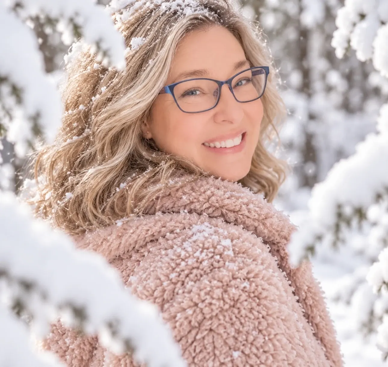 Amy Matthew in a blush coat in the snow